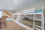 BEDROOM 6 - BUNK ROOM - 3 PYRAMID BEDS- 3 FULL & 3 TWIN  THEN 3 TRUNDLE BEDS  3 TWIN BEDS  & A SOFA SLEEPER BED IN THE DETACHED BUNK/ACTIVITY ROOM WITH SHUFFLEBOARD, AIR HOCKEY, MS.PAC MAN, LARGE TV & A REFRIGERATOR FOR THOSE REFRESHING BEVERAGES